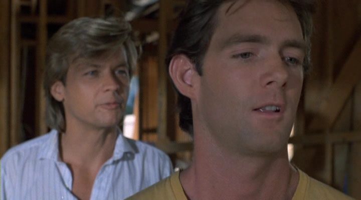 Brandon (left) and Jim have a not-so-friendly discussion about Ouija boards and the woman they both love.