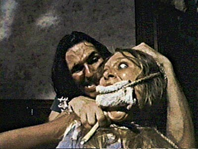 As the hitchhiker holds her hostage, Sally can think of about a million other places she'd rather be.